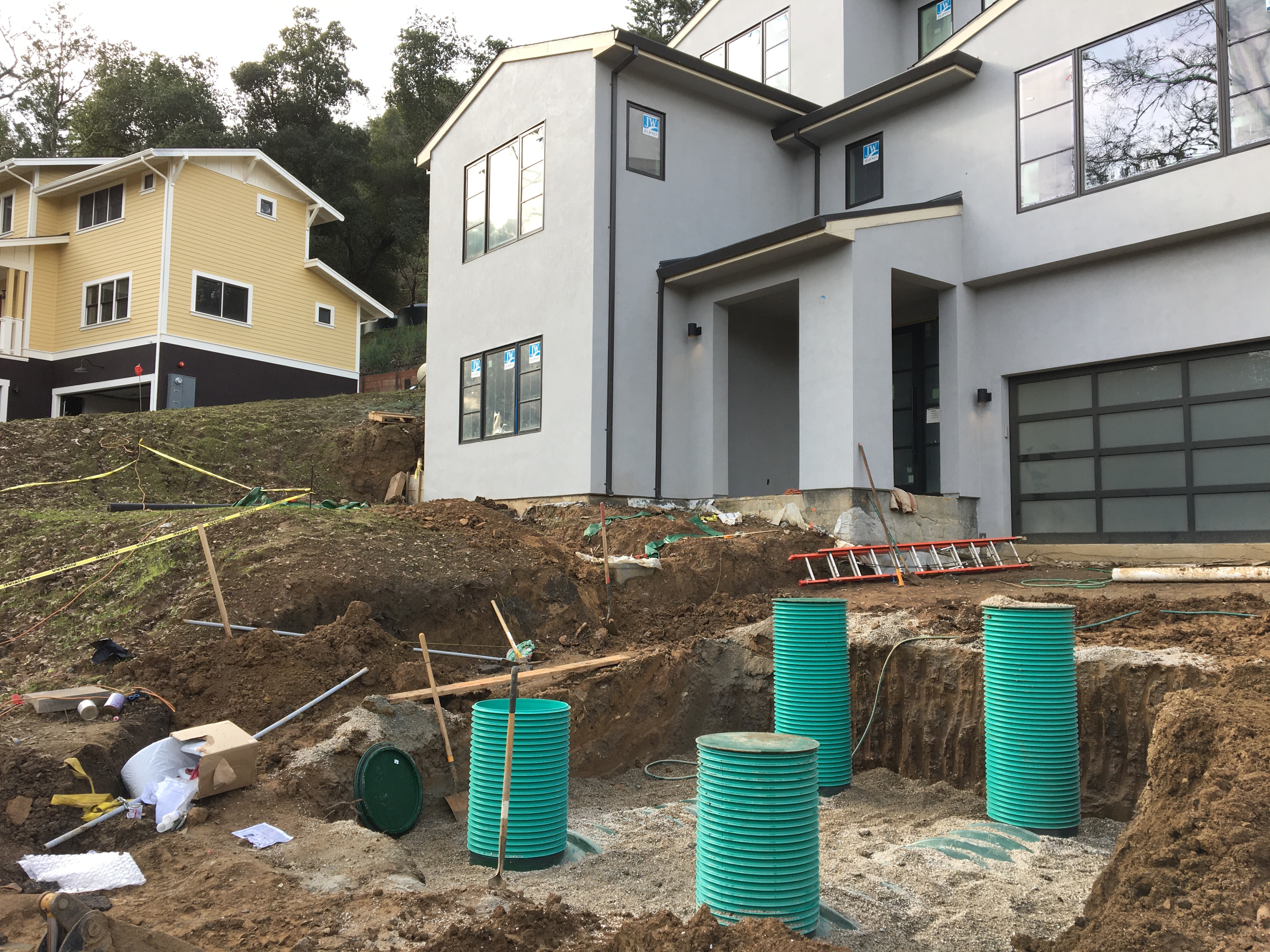Image of a newly constructed home with Septic Wastewater Treatment System being installed