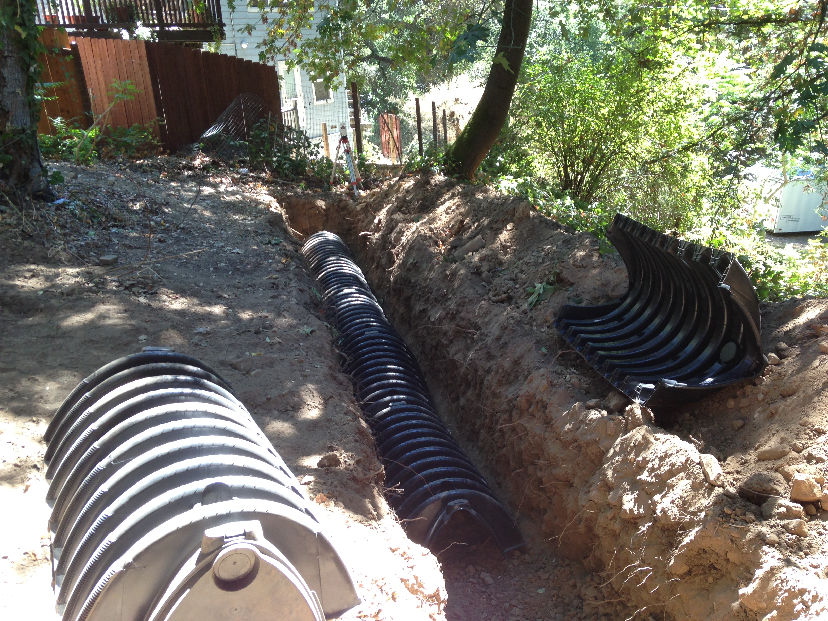 Image showing a property getting new septic pipes installed in the backyard