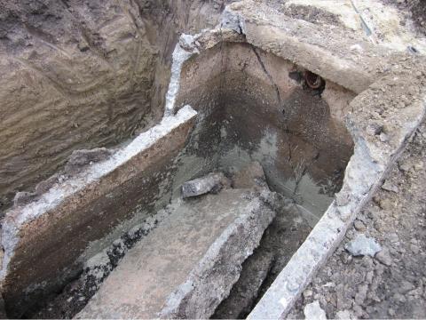 Image of an exposed, dug-up pipe
