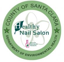 County of Santa Clara Department of Environmental Health's Healthy Nail Salon logo - green ring around a white circle with a flower in the middle